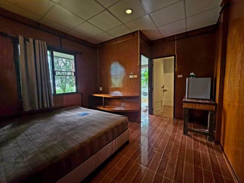 Postel nebo postele na pokoji v ubytování Hillhouse bungalow