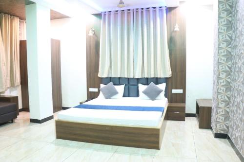 Postel nebo postele na pokoji v ubytování Hotel Nandini