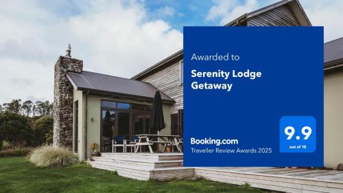 a house with a sign that saysancy lodge gateway at Serenity Lodge Getaway - with river views in Egmont Village
