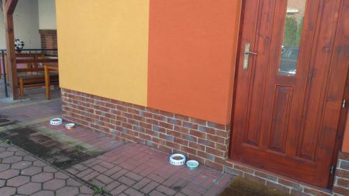 a door of a building with buckets on the side of it at Penzión Pars in Žilina