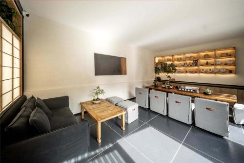 a living room with a couch and a table at Silent NOISELESS Homestay in Lijiang