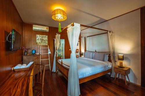 Ένα ή περισσότερα κρεβάτια σε δωμάτιο στο Pao Come Boutique House