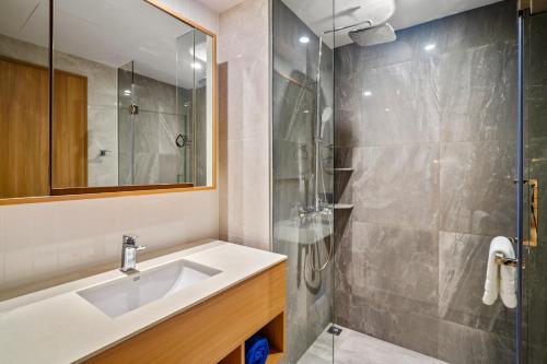 a bathroom with a sink and a shower at Laguna Beachside Residences Building 2 by Banyan Living in Bang Tao Beach