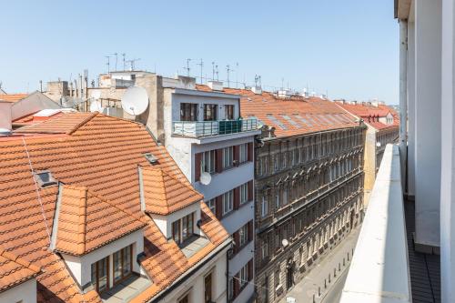 a view of the roofs of buildings in a city at Hotel Andante in Prague