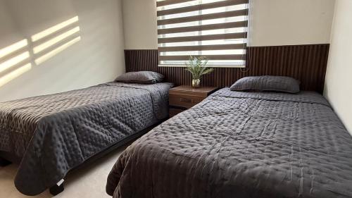 Ένα ή περισσότερα κρεβάτια σε δωμάτιο στο Casa La Amistad Comoda Casa con 3 Habitaciones