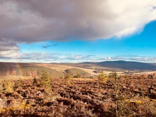 a view of the mountains from the top of a hill at Brylach Steading in Aberlour