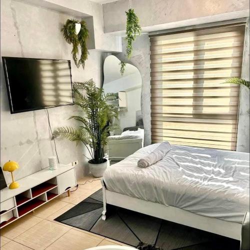 Ένα ή περισσότερα κρεβάτια σε δωμάτιο στο East Service Road Condotels