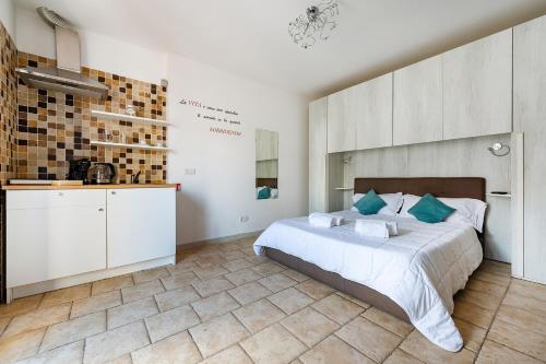 Ένα ή περισσότερα κρεβάτια σε δωμάτιο στο Helios Vacanze