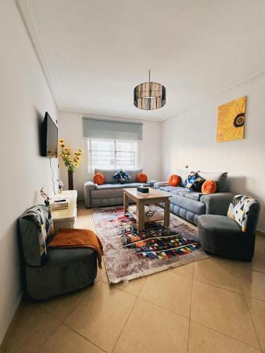 Posezení v ubytování bel appartement à la plage des nations