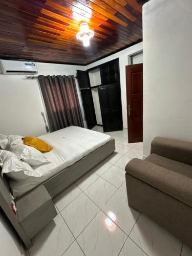 En eller flere senge i et værelse på Cozy Tower