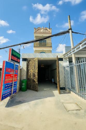 an entrance to a building with a open door at Hoàng Gia 2 Motel Long An in Ðức Hòa