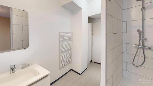 a white bathroom with a shower and a sink at T2 Cozy & Elegant, 5 min walk to Nausicaá in Boulogne-sur-Mer
