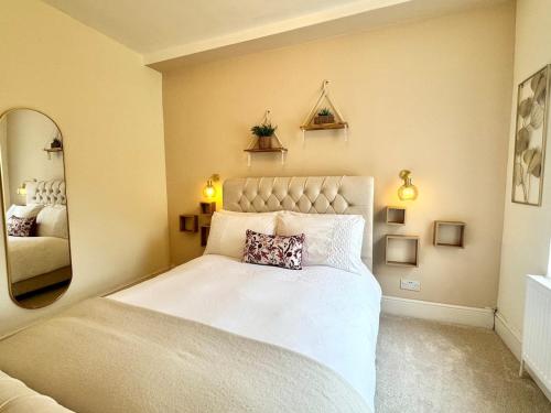 Ένα ή περισσότερα κρεβάτια σε δωμάτιο στο The Palms at No10 - Spacious and Family Friendly