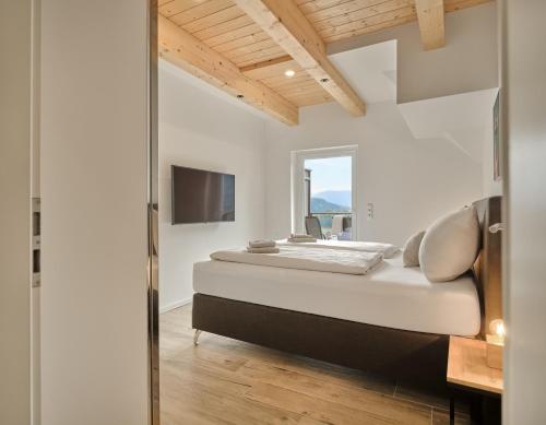 Postel nebo postele na pokoji v ubytování Penthouse Cassiopeia by AA Holiday Homes SKI IN SKI OUT