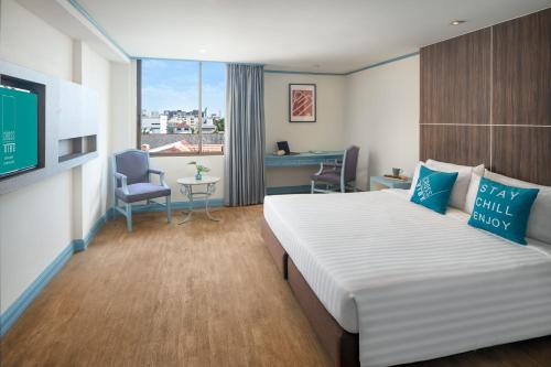 Postel nebo postele na pokoji v ubytování King Park Avenue Hotel Bangkok