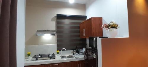 Kuchyň nebo kuchyňský kout v ubytování SHA Apartments