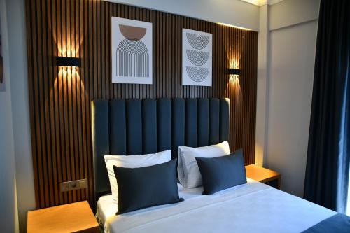 Ένα ή περισσότερα κρεβάτια σε δωμάτιο στο MyElla Marina Hotel