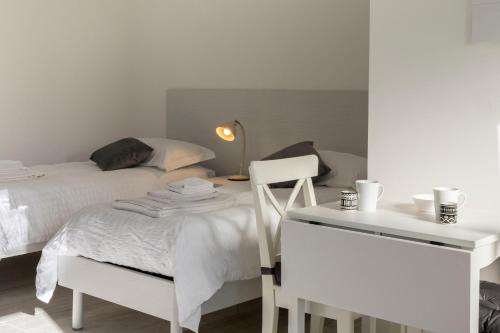 Ένα ή περισσότερα κρεβάτια σε δωμάτιο στο Casa Gialla - Appartamento Sole