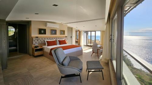 a bedroom with a bed and a view of the ocean at Reev Coffee House in Antalya