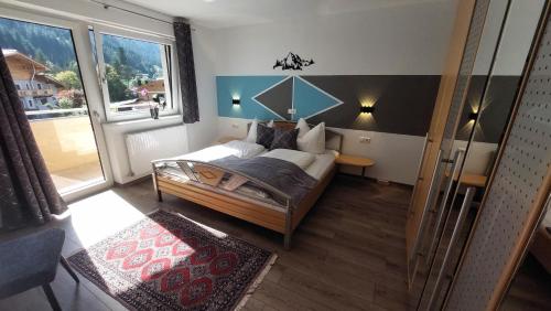 Ένα ή περισσότερα κρεβάτια σε δωμάτιο στο Haus Aloisia