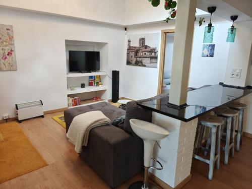 a living room with a bar and a couch at Casa Diego in Melias