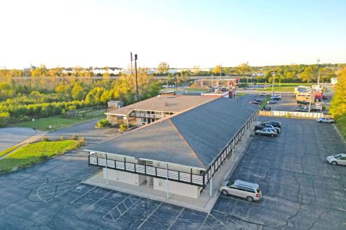 an aerial view of a building with a parking lot at Brookville Inn By OYO Near Dayton International Airport in Brookville
