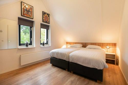 Postel nebo postele na pokoji v ubytování Esdorp Bungalow Deluxe | 4 personen