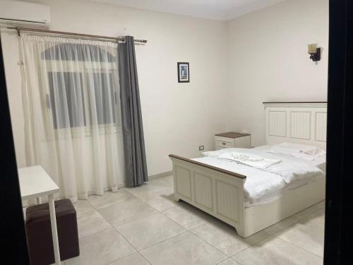 Ένα ή περισσότερα κρεβάτια σε δωμάτιο στο 808名墅 新开罗国际会展中心店