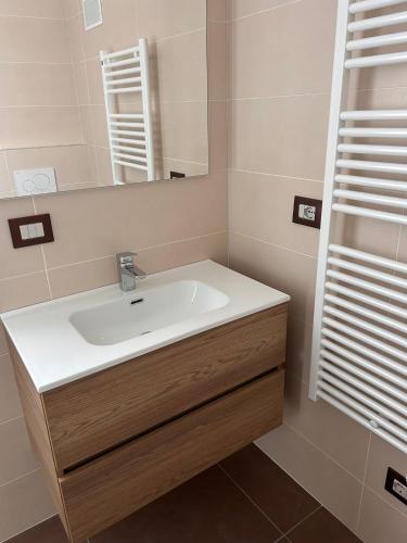 a bathroom with a sink and a mirror at RiVaLoVE in Nerviano