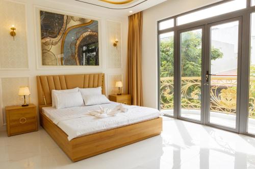 Ένα ή περισσότερα κρεβάτια σε δωμάτιο στο Fara Home - Phan Rang Homestay