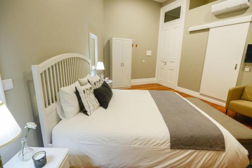 Ένα ή περισσότερα κρεβάτια σε δωμάτιο στο GuestReady - Casa Conforto & Chiado