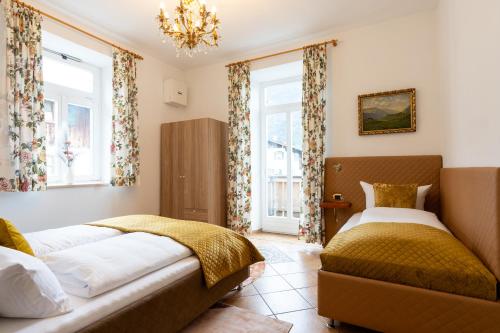 Ένα ή περισσότερα κρεβάτια σε δωμάτιο στο Höllental heritage house - Alpspitzblick - 1