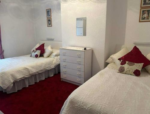 Ένα ή περισσότερα κρεβάτια σε δωμάτιο στο Walcot Hotel