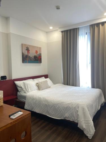 Ένα ή περισσότερα κρεβάτια σε δωμάτιο στο Anmie Home - Hoàng Huy CMC Camelia