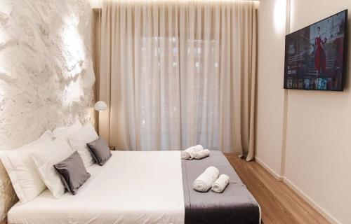 Ένα ή περισσότερα κρεβάτια σε δωμάτιο στο Lumino apartment