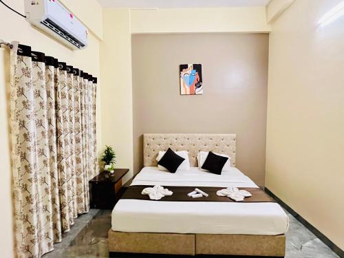 Ένα ή περισσότερα κρεβάτια σε δωμάτιο στο Hotel Sai 9 Heaven A Quality Apartment Perfect for Families