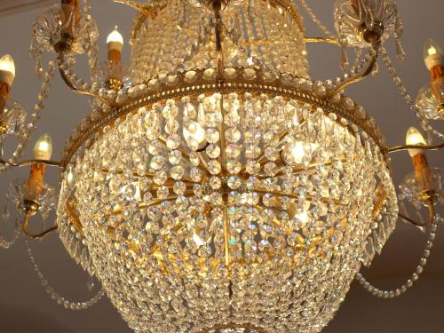 a close up of a chandelier at Hotel Schweizerhof Sta Maria in Sta Maria Val Müstair