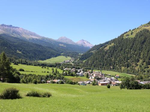 a village in a valley with mountains in the background at Hotel Schweizerhof Sta Maria in Sta Maria Val Müstair