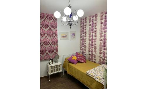 Ένα ή περισσότερα κρεβάτια σε δωμάτιο στο Casa Rural Abuela Carolina