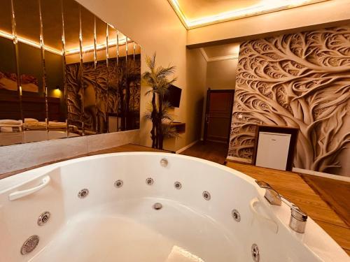 a bathroom with a large bath tub in a room at OTTO Boutique in Ankara