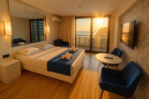 Ένα ή περισσότερα κρεβάτια σε δωμάτιο στο Orbi City Panorama Hotel In Batumi