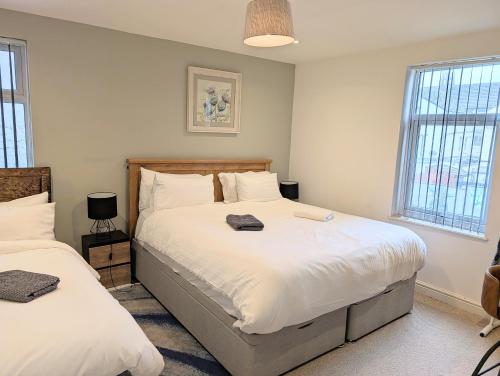 Postel nebo postele na pokoji v ubytování No 10 Apartments