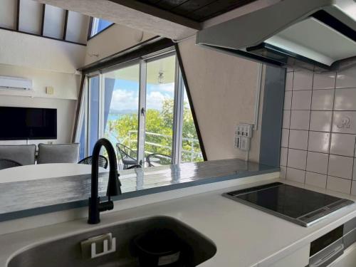 Kuchyň nebo kuchyňský kout v ubytování オーシャンフロントヴィラSerenity Point37