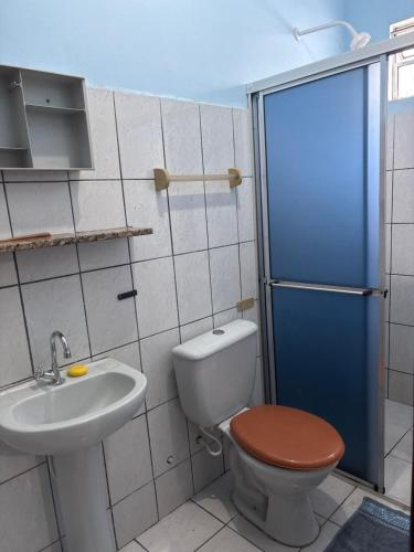 a bathroom with a toilet and a sink at Pousada São luis in Belém
