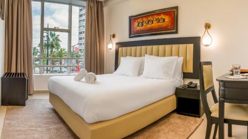 Postel nebo postele na pokoji v ubytování Hotel Al Walid