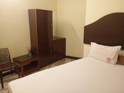 En eller flere senge i et værelse på Thirumala palace