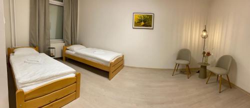 Postel nebo postele na pokoji v ubytování Lux Konštantínova