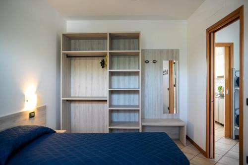 Giường trong phòng chung tại Villaggio Ducale