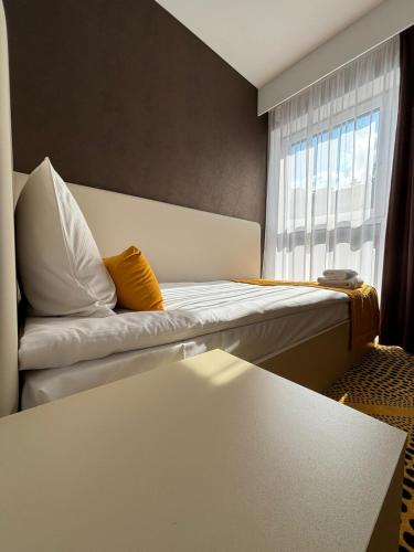 Ένα ή περισσότερα κρεβάτια σε δωμάτιο στο Eclipse Budget Rooms