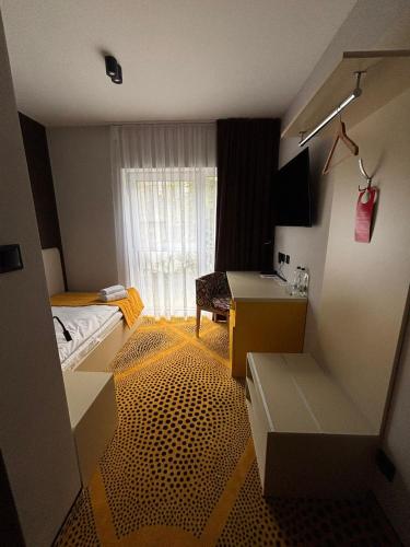 Ένα ή περισσότερα κρεβάτια σε δωμάτιο στο Eclipse Budget Rooms